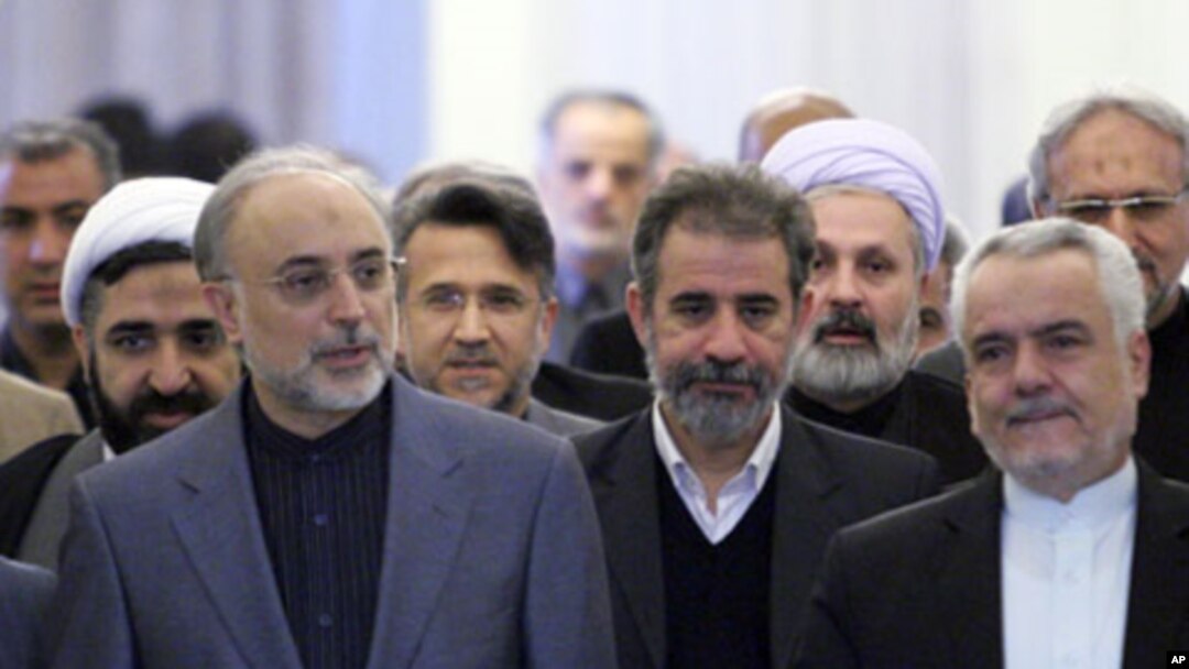 Ali Akbar Salehi, head of Iran's Atomic Energy Organisation (front, L), arrives for former Foreign Minister Manouchehr Mottaki's official farewell ceremony in Tehran, 18 Dec 2010