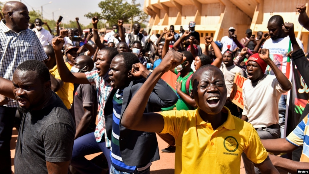 People hold a protest following an attack on security forces that killed 53 people, calling on Burkina Faso's President Roch Kabore to resign, in Ouagadougou, Burkina Faso, Nov. 16, 2021.