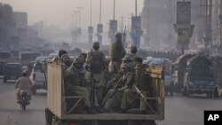 Paramilitary forces patrol the streets of Peshawar, in northwest Pakistan November 26, 2011. NATO helicopters attacked a military checkpoint in northwest Pakistan on Saturday, killing up to 28 troops and prompting Pakistan to shut vital supply routes for