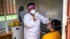 Asnath Masango, gives a patient a COVID-19 test at the Ndlovu clinic in Elandsdoorn, 200 kms north-east of Johannesburg Thursday Feb. 11, 2021. The center is running a study of the Johnson & Johnson COVID-19 vaccine.