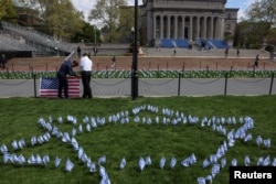 Students place flags near the main lawn of Columbia University, to show support for the Jewish community on campus, in New York City, U.S., April 25, 2024. (REUTERS/Caitlin Ochs)