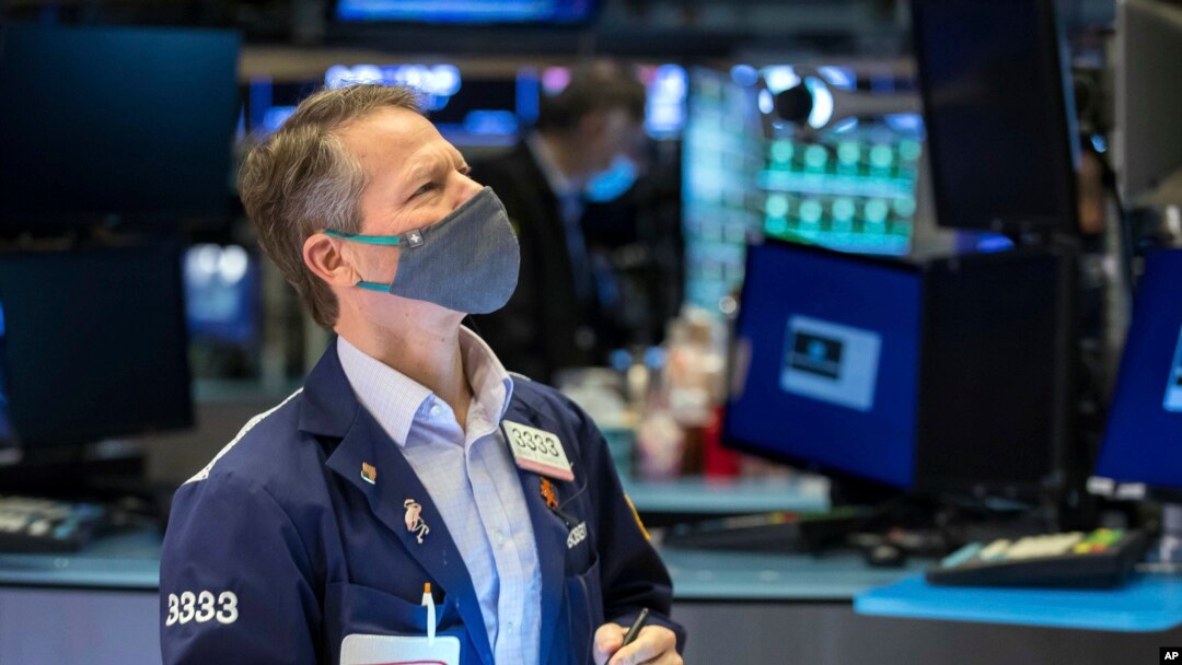 Trader Robert Charmak works on the floor on Jan. 24, 2022, in this photo provided by the New York Stock Exchange,