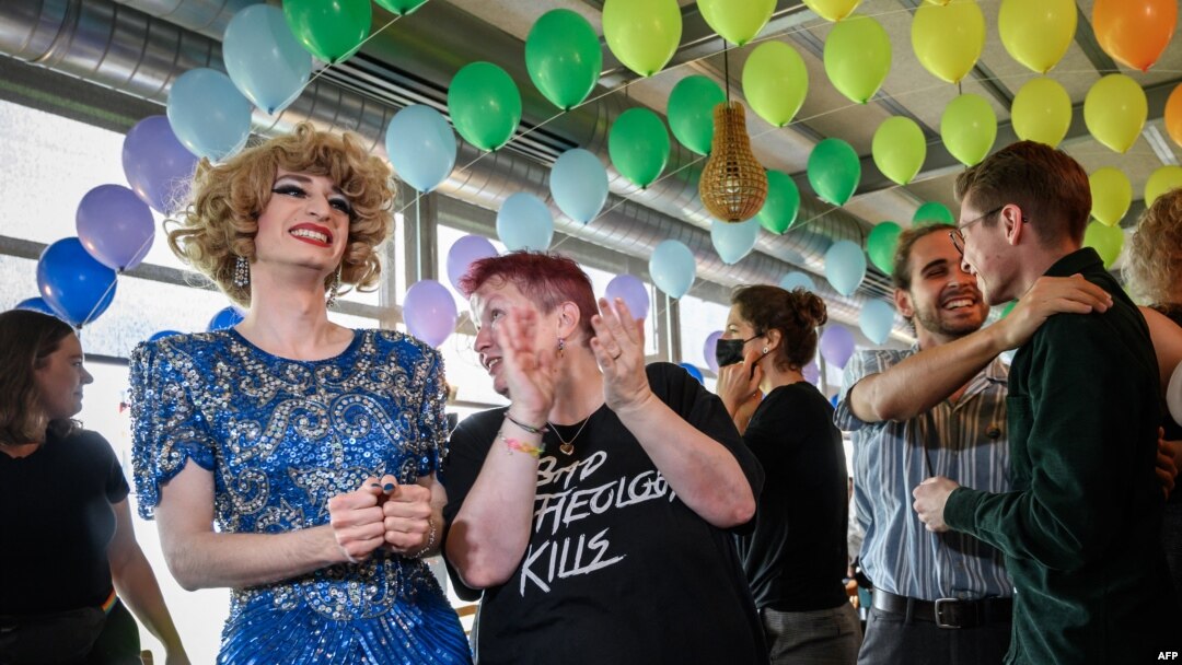 Campaigners react during the first projections following a nationwide referendum on same-sex marriage, in Swiss capital Bern, Sept. 26, 2021.