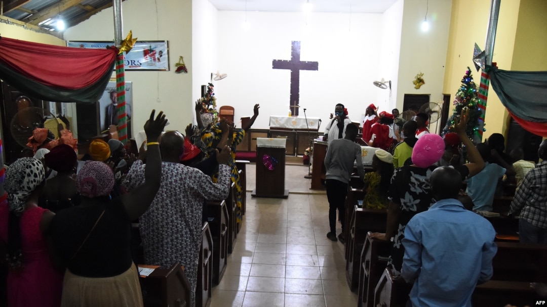 FILE - People worship at the Anglican Church of Redemption, Diocess of Lagos West, Ibafo in Ogun State, southwest Nigeria, Jan. 1, 2021. A report by a U.S-based monitoring group says Nigeria became the world's biggest killing spot for Christians in 2020.