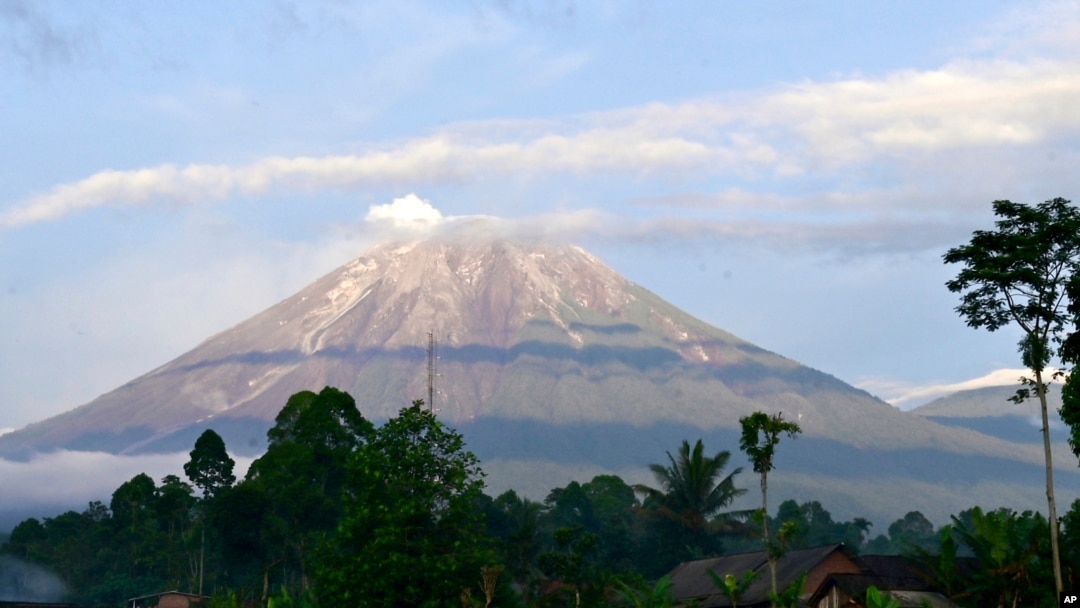 Mount Semeru is seen in Lumajang district, East Java province, Indonesia, Saturday, Dec. 18, 2021. 