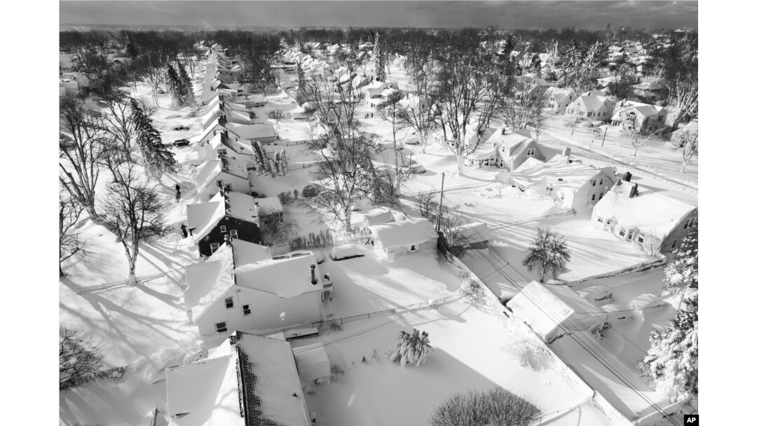 In this drone image, snow blankets a neighborhood, Dec. 25, 2022, in Cheektowaga, NY.