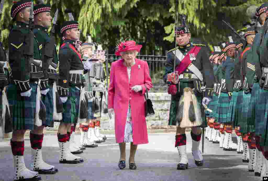 Britain's Queen Elizabeth II is seen during an inspection of the Balaklava Company, 5 Battalion The Royal Regiment of Scotland at the gates at Balmoral, Scotland, as she takes up summer residence at the castle.