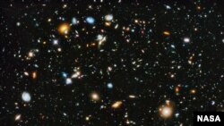 FILE - Astronomers using NASA's Hubble Space Telescope assemble a comprehensive picture of the evolving universe – among the most colorful deep space images ever captured by the 24-year-old telescope.
