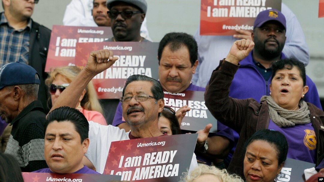 FILE - Community activists rally during an event on Deferred Action for Childhood Arrivals, DACA, and Deferred Action for Parental Accountability, DAPA, in Los Angeles, Feb. 17, 2015.