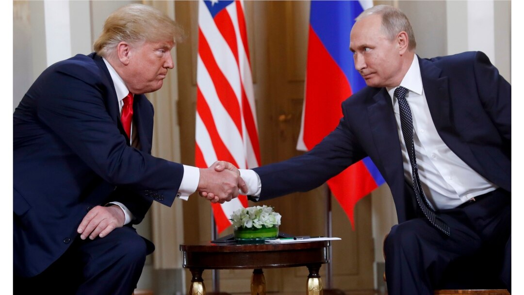 FILE - U.S. President Donald Trump, left, and Russian President Vladimir Putin shake hands at the beginning of a their bilateral meeting at the Presidential Palace in Helsinki, Finland, July 16, 2018.