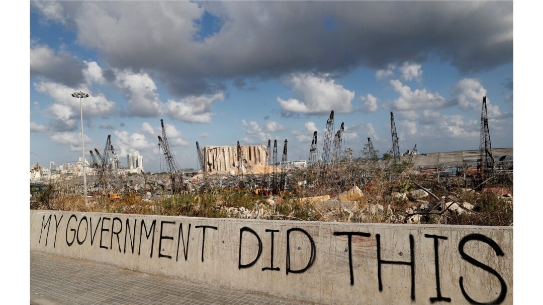 FILE - Words are written by Lebanese citizens in front of the scene of the Aug. 4 explosion that hit the seaport of Beirut, Lebanon, Aug. 9, 2020.