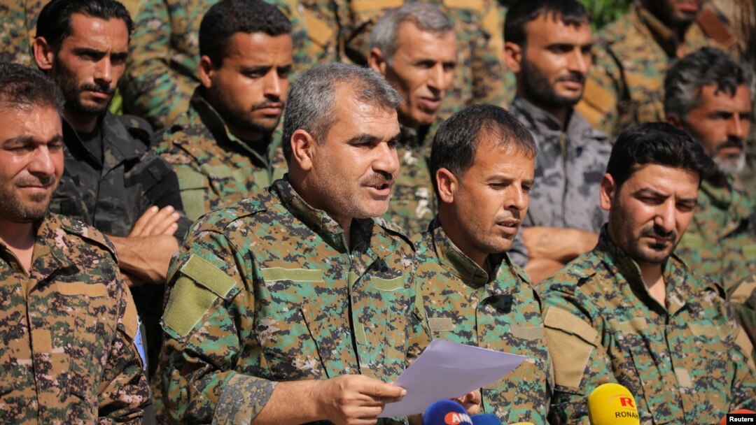 Spokesperson for the Manbij Military Council Shurfan Dawish speaks during a news conference in Manbij, Syria, June 6, 2018. 