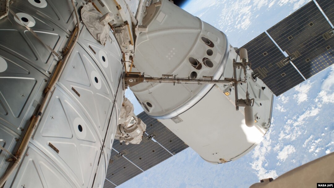 FILE - The SpaceX Dragon spacecraft is shown docked at the International Space Station.