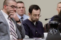 Larry Nassar sits with attorney Matt Newburg during his sentencing hearing, Jan. 24, 2018, in Lansing, Mich.