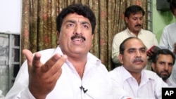 FILE - Jamil Afridi, left, holds a news conference in Peshawar, Pakistan, May 28, 2012. He contends his physician brother – Shakil Afridi, who helped the United States find Osama bin Laden – was the victim of a sham trial in Pakistan. Shakil Afridi is serving a 33-year sentence.
