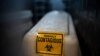 A sealed coffin containing the remains of a COVID-19 victim is stored in a refrigerated container in Johannesburg, South Africa, Feb. 2, 2021. 