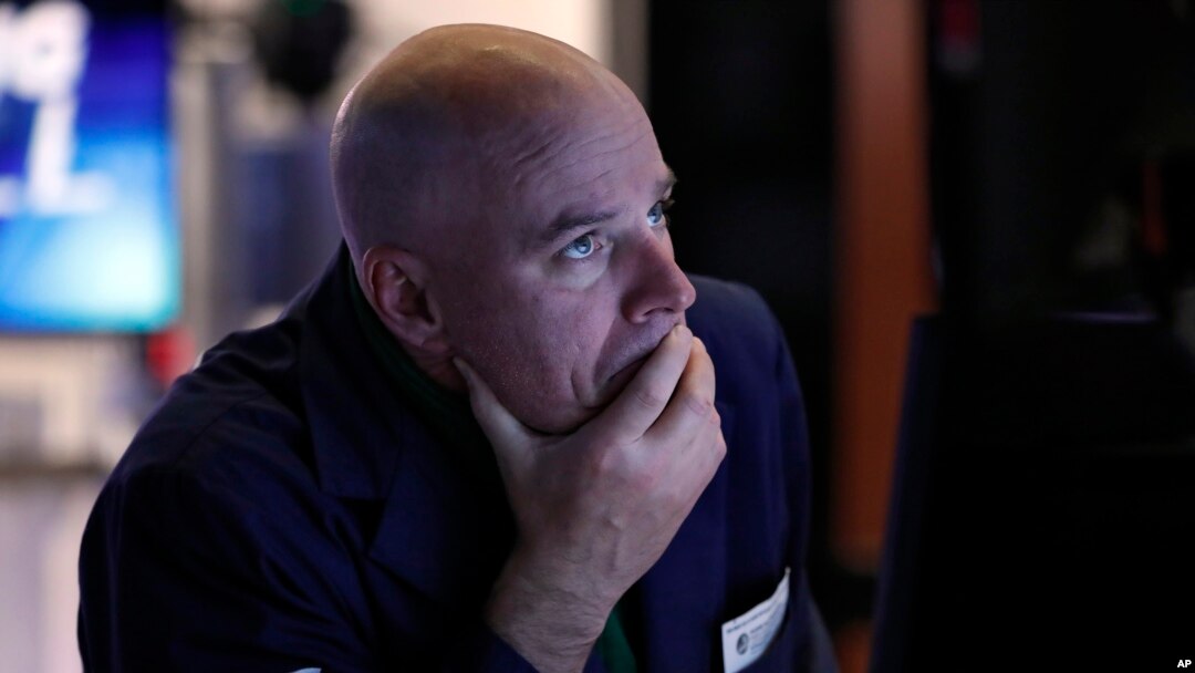 Specialist John O'Hara works at his post on the floor of the New York Stock Exchange, March 12, 2020.