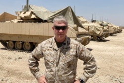 FILE - Marine Gen. Frank McKenzie, the top U.S. commander for the Middle East, speaks to the media after arriving in Syria to meet with U.S. and allied commanders and troops, May 21, 2021.