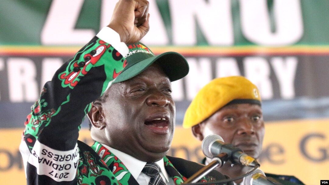 FILE - Zimbabwe’s President Emmerson Mnangagwa (R) is seen at a ZANU-PF congress where he was said to still be consulting on senior party appointments, in Harare, Dec. 15, 2017. 