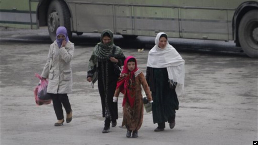 Women walk in Kabul, Afghanistan, on Wednesday, Jan. 4, 2012. The UN says the number of reported violent attacks against Afghan women has more than doubled in a year. 