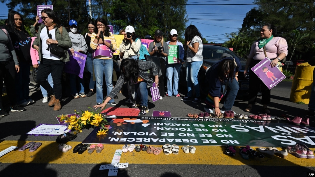 FILE - Women belonging to the feminist collective protest against the rape of girls that occurred in the last few months in San Salvador, on October 18, 2023. 