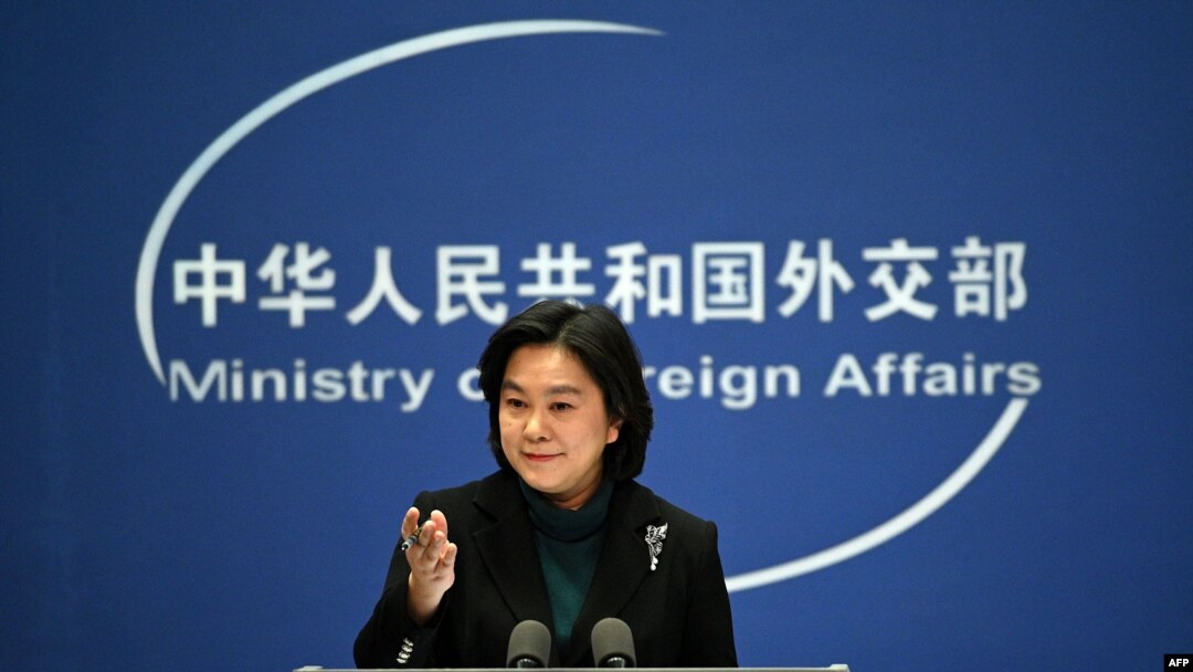 FILE - Chinese Foreign Ministry spokesperson Hua Chunying gestures during the daily Press conference at the Foreign Ministry in Beijing, Feb. 24, 2022. 