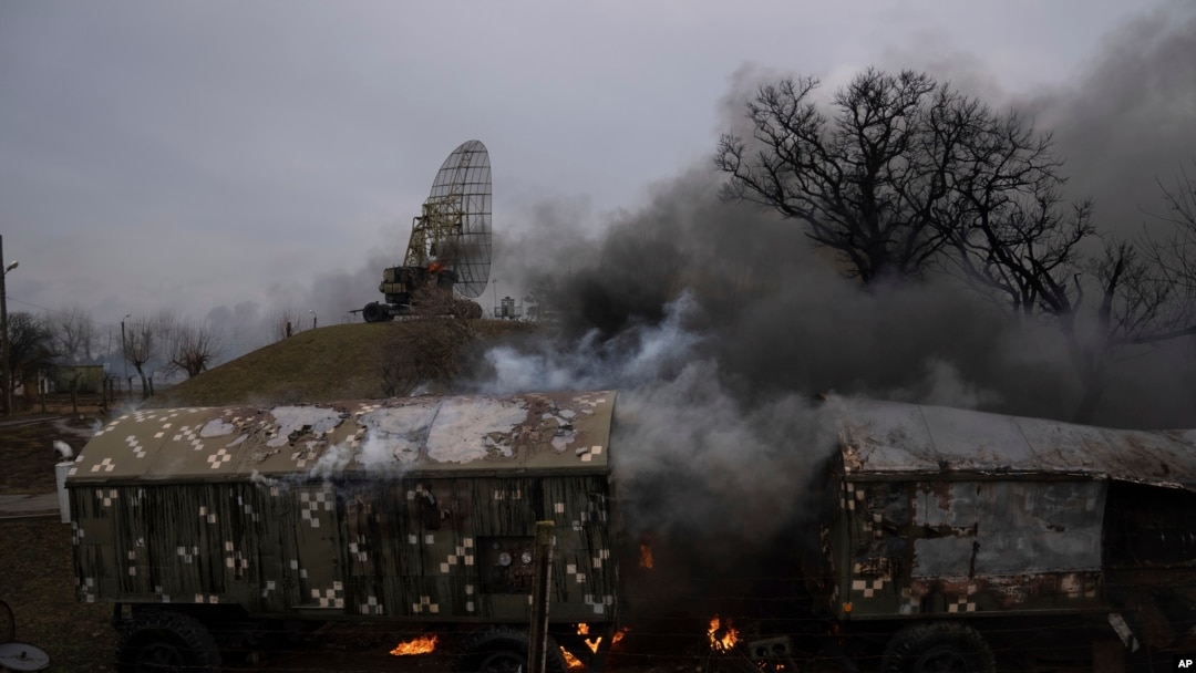 Smoke rise from an air defence base in the aftermath of an apparent Russian strike in Mariupol, Ukraine, Feb. 24, 2022. Big explosions were heard before dawn in Kyiv, Kharkiv and Odesa as world leaders decried the start of Russian invasion (AP Photo/Evgeniy Maloletka)
