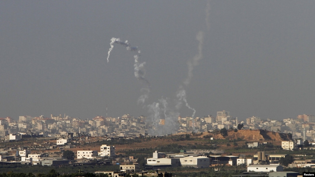 Trails of smoke are seen after the launch of rockets from the northern Gaza strip towards Israel, November 11, 2012. 