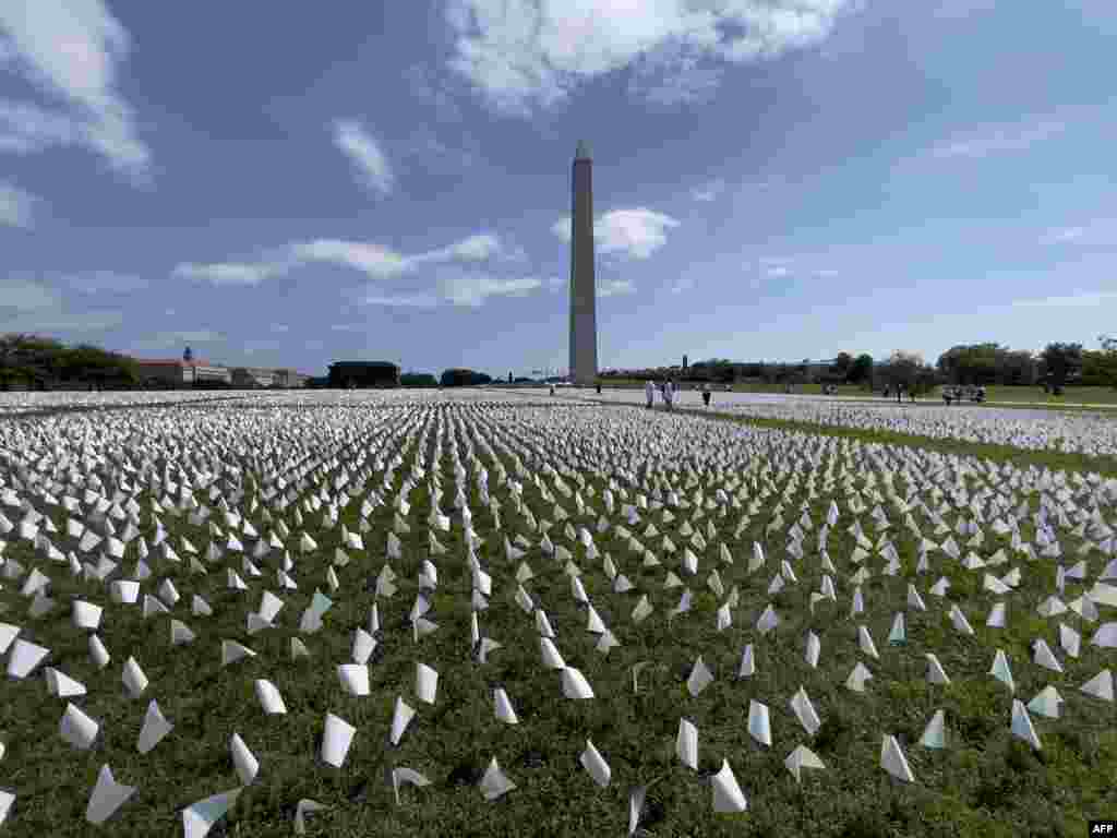 White flags are seen on the National Mall near the Washington Monument in Washington, D.C., Sept. 19, 2021.