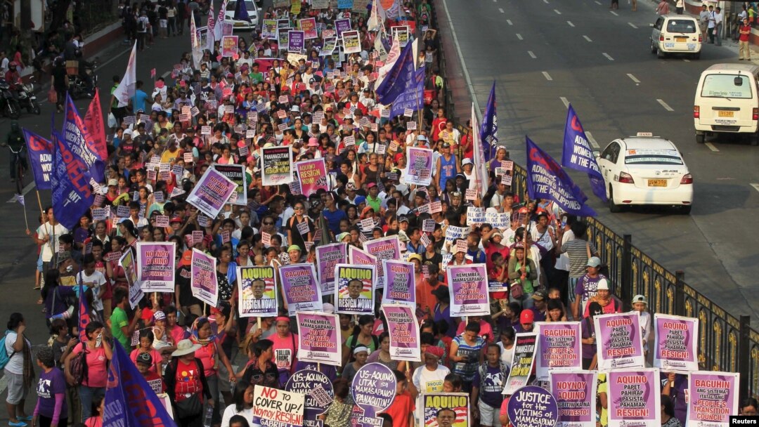 The raid in which Zulkifli bin Hir was killed also left 44 police commandos dead, and a Philippine senate panel held President Benigno Aquino responsible for the bungled operation. Above, protesters march toward the presidential palace in Manila, March 20, 2015.