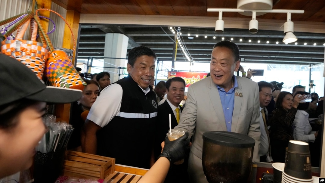 Thai Prime Minister Srettha Thavisin, center right, visits Ploenchit market in Bangkok, Thailand, Aug. 14, 2024.