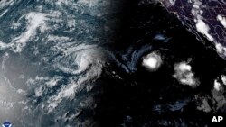 This satellite image provided by the National Oceanic and Atmospheric Administration shows Tropical Storm Hone and Hurricane Gilma located southeast of Hawaii on Aug. 22, 2024.