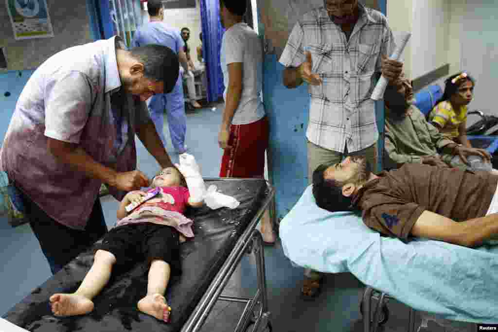 Patients are treated in Shifa hospital in Gaza City, July 18, 2014.
