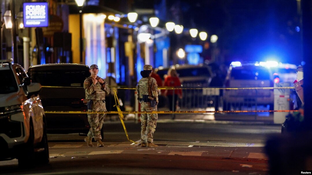 Military personnel stand near the site where people were killed by a man driving a truck in an attack during New Year's celebrations, in New Orleans, Louisiana, Jan. 1, 2025.