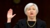 New Fed Chief Faces Reporters