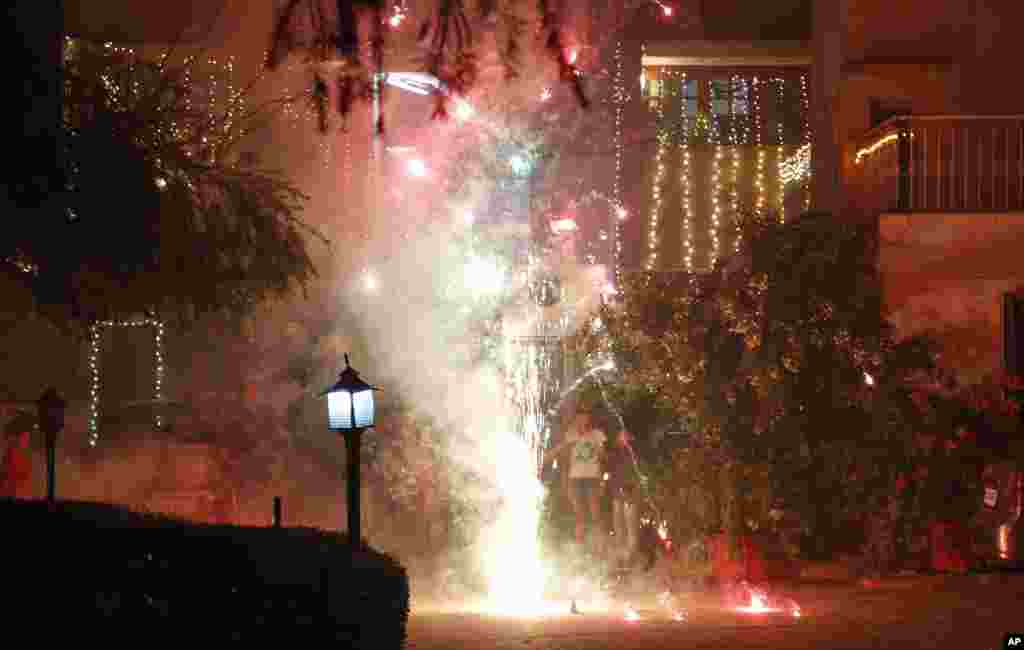 People set off fireworks to celebrate Diwali, Jammu, India, Nov. 3, 2013.