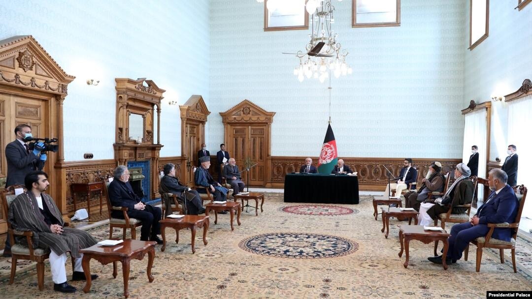 Ghani-Abdullah deal signing in Kabul, Afghanistan, May 17, 2020, in the presence of senior political figures including former President Hamid Karzai. (Credit: Afghan Presidential Palace)
