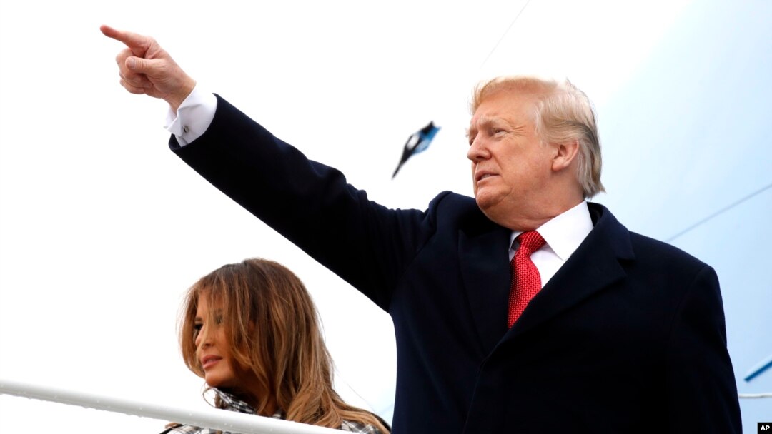 President Donald Trump and first lady Melania Trump board Air Force One at Andrews Air Force Base, Md., en route to Paris, Nov. 9, 2018, where they will participate in World War I commemorations.