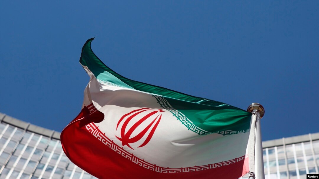 FILE - An Iranian flag flutters in front of U.N. offices in Vienna.
