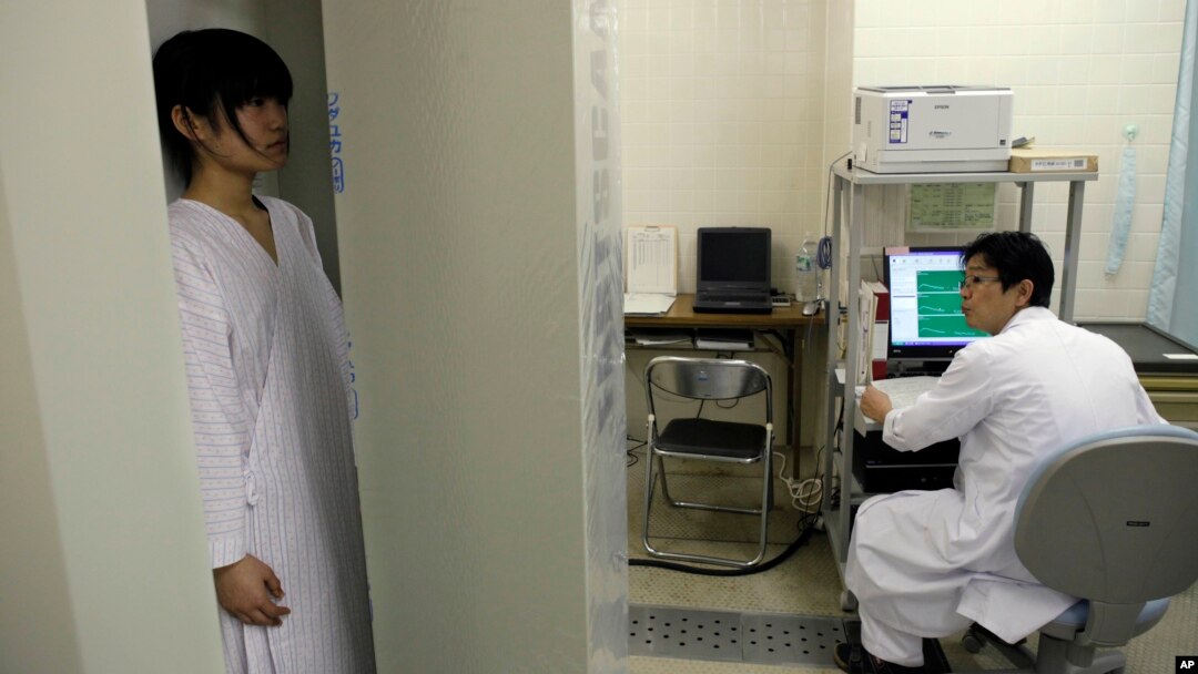 Satomi Kuroki, a 13-year-old junior high school student, receives a whole-body counter radiation check at Minimisoma City General Hospital just outside the 20-kilometer Fukushima Prefecture, Japan, March 7, 2012. 