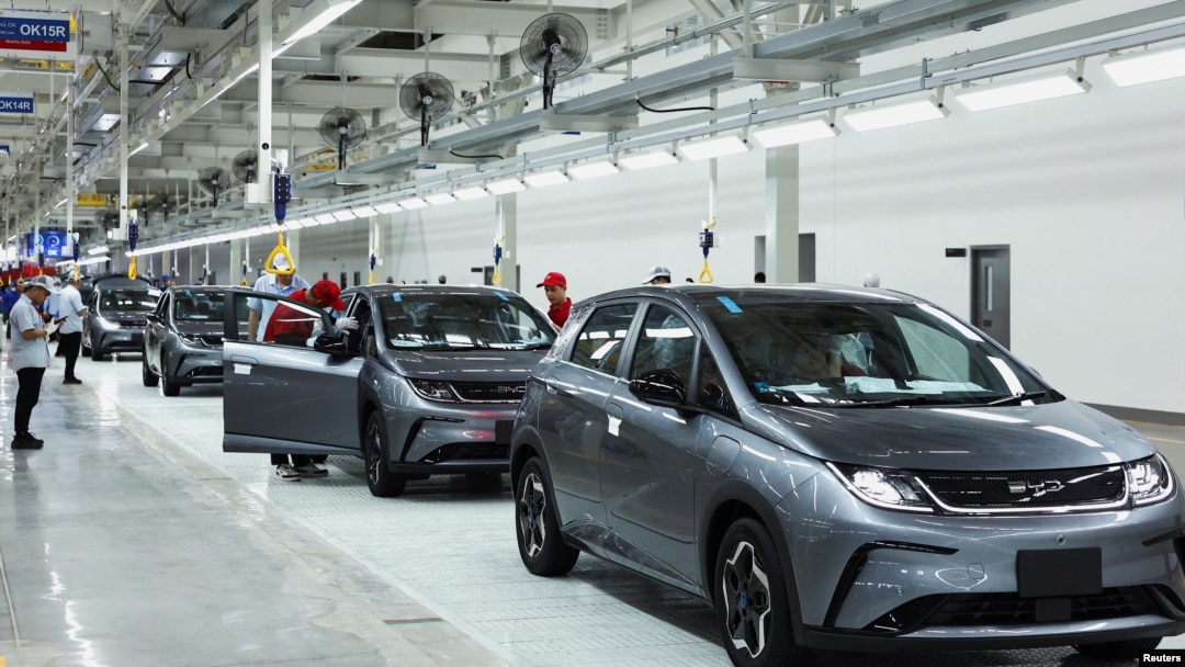 FILE - Workers check the EV cars inside BYD's first electric vehicle (EV) factory in Southeast Asia, a fast-growing regional EV market where it has become the dominant player, in Rayong, Thailand, July 4, 2024.