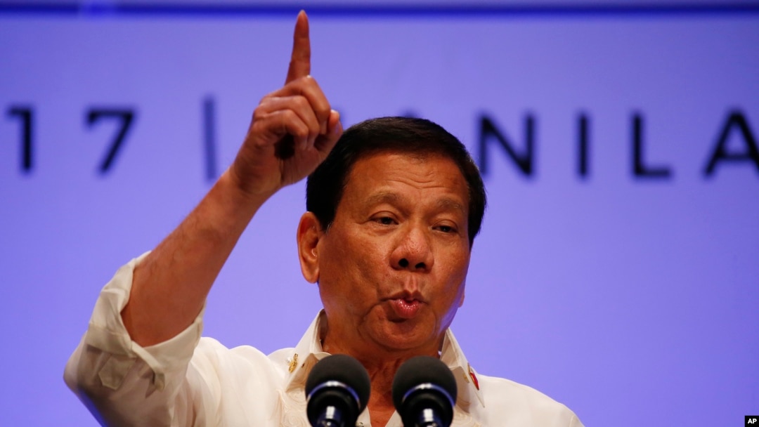 FILE - Philippines President Rodrigo Duterte gestures while addressing the media following the conclusion of the 30th ASEAN Leaders' Summit in Manila, Philippines.