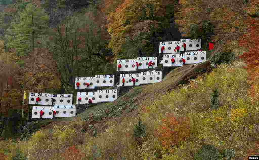 Referees check the targets of the traditional 'Ruetlischiessen' (Ruetli shooting) competition over a distance of 300 meters (984 ft) at the Ruetli meadow in central Switzerland.