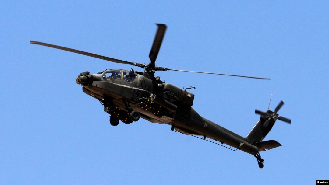 An Egyptian military helicopter is seen deployed in the northeastern part of the Sinai Peninsula near the Rafah border crossing between Egypt and the Gaza Strip in this May 21, 2013, file photo.