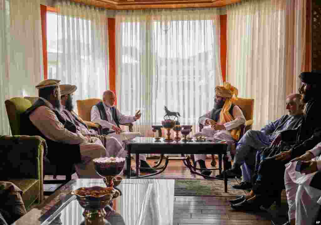 Former Afghan President Hamid Karzai, center left, senior Haqqani group leader Anas Haqqani, center right, Abdullah Abdullah, 2nd right, head of Afghanistan's National Reconciliation Council and former government negotiator with the Taliban, and others in the Taliban delegation, meet in Kabul. (Image released by Taliban)
