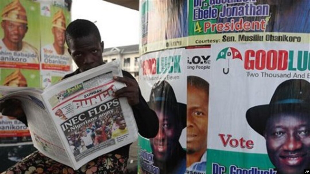 A man reads a local newspaper in Lagos, April 3, 2011
