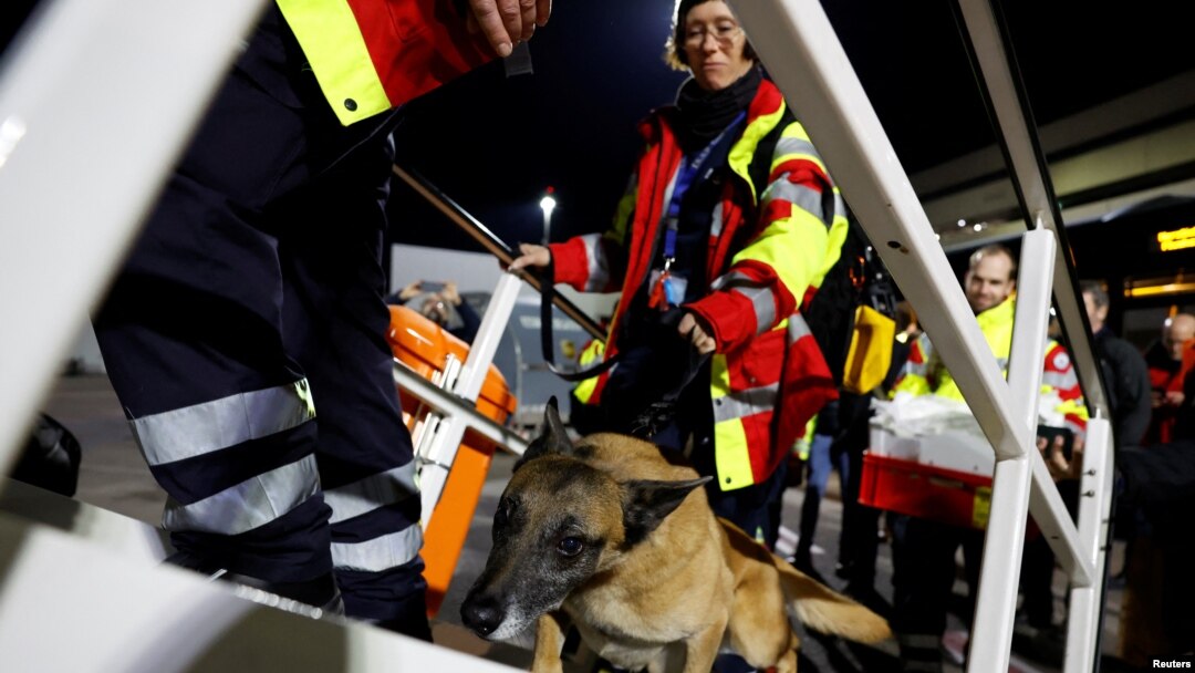 Rescuers of International Search and Rescue (ISAR) Germany board a charter plane, on their way to help find survivors of the deadly earthquake in Turkey, at Cologne-Bonn airport, Germany, Feb. 7, 2023. 