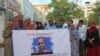 Supporters demand the release of arrested Somali journalist Abdiaziz Ahmed Gurbiye in a photo posted on Twitter by the Somali Journalists Syndicate SJS. (@sjs_Somalia)