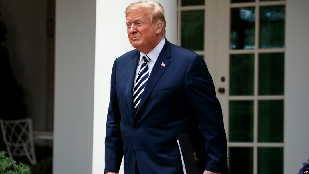 FILE - President Donald Trump arrives for a bill signing ceremony for the "VA Mission Act" in the Rose Garden of the White House, June 6, 2018, in Washington.