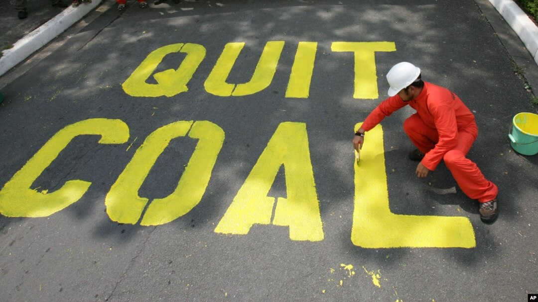 FILE - Activists protest the use of coal in the Philippines, June 3, 2008. Decreasing the world's reliance on coal and other fossil fuels is key to global health, said participants Thursday at the World Climate Summit in Washington.
